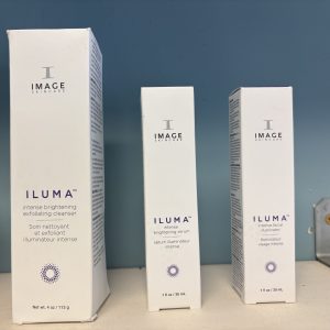 Three white skincare product boxes labeled ILUMA by IMAGE Skincare.