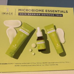 Skin barrier defense trio set with three green skincare products on a yellow background.