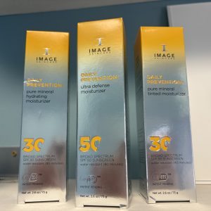 Three skincare product boxes with SPF 30 and 50 from Image Skincare.